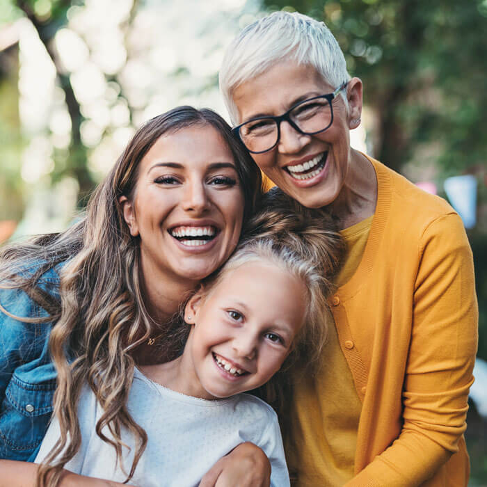 Portrait of happy grandmother, mother and daughter