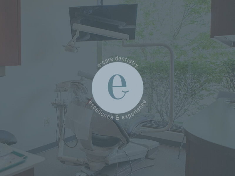 E-Care Dentistry's patient chair with overlay and logo